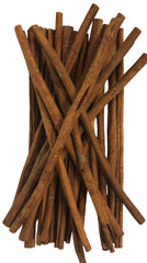 Stack of cinnamon sticks on a white background