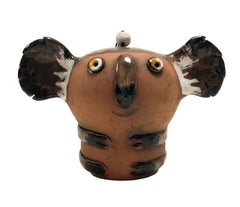 Ceramic koala figurine on a white background