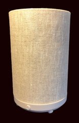 Textured cylindrical oil diffuser on a dark background